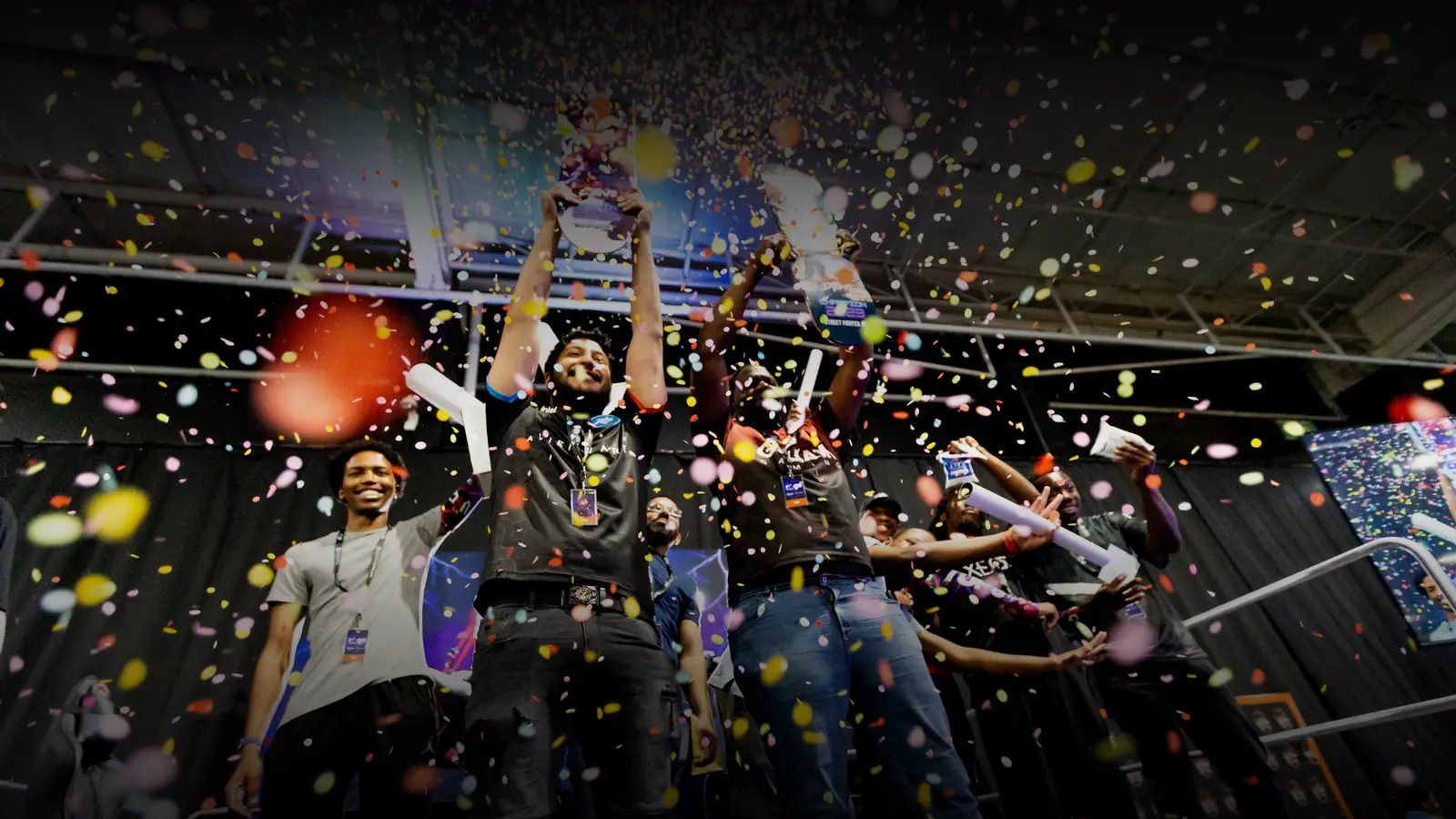 Confetti falling over players celebrating at the end of a UGCZA event.